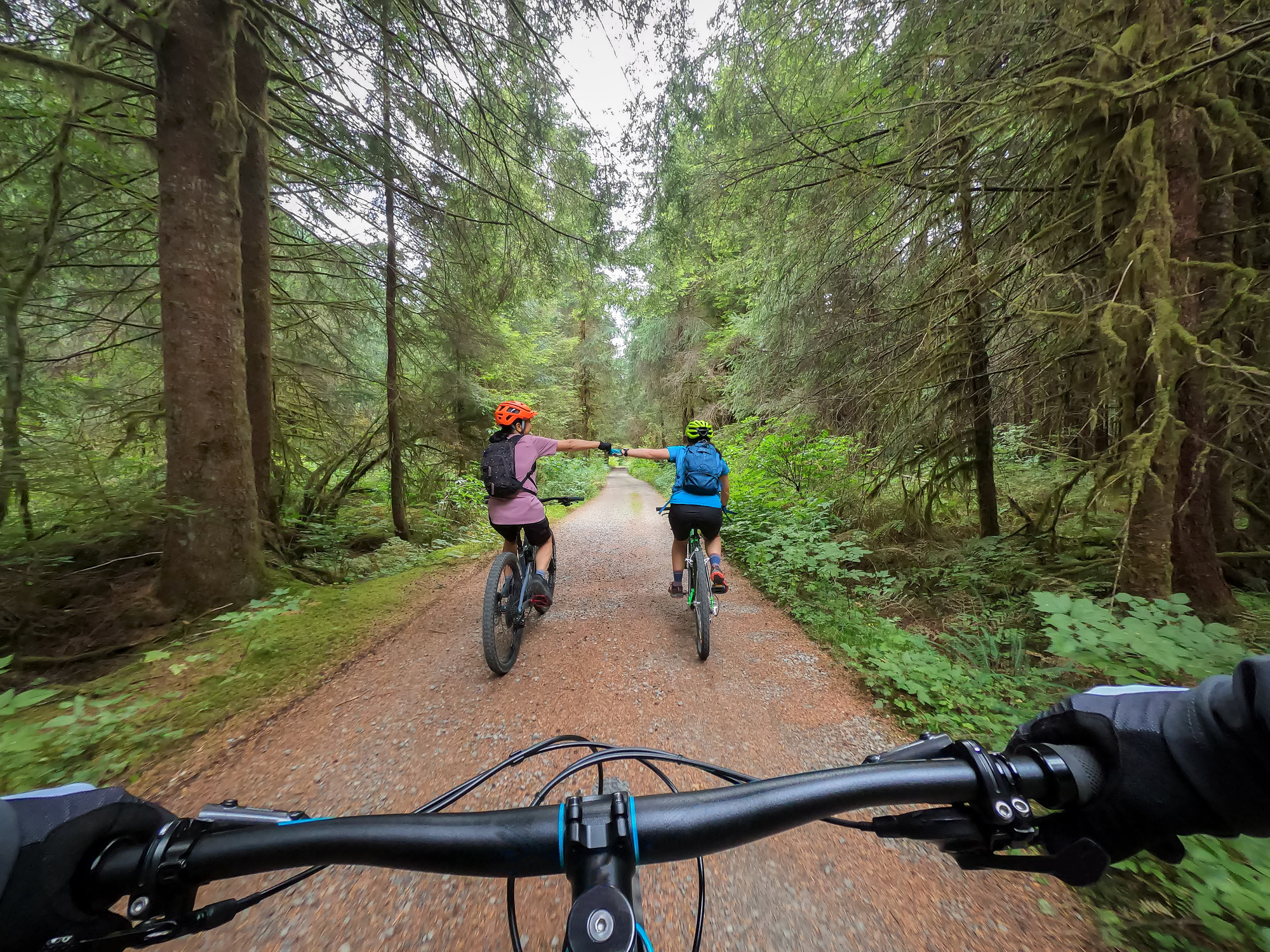 POV, Mother and Daughter Fist Bumping While Trail Riding Bikes
