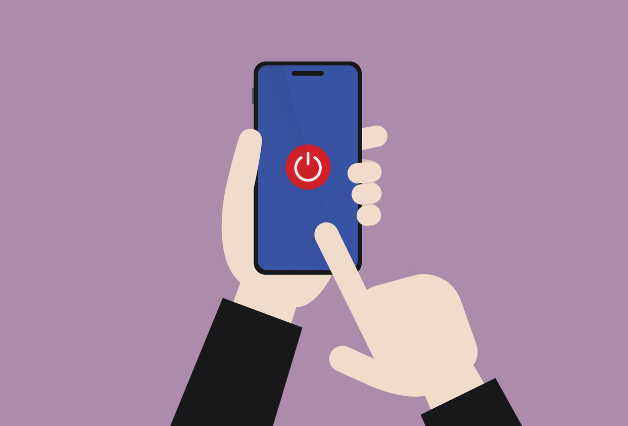 The businessman turns off a mobile phone