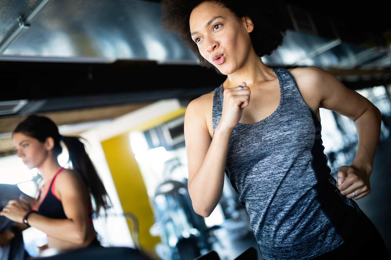 Close up image of attractive fit woman in gym