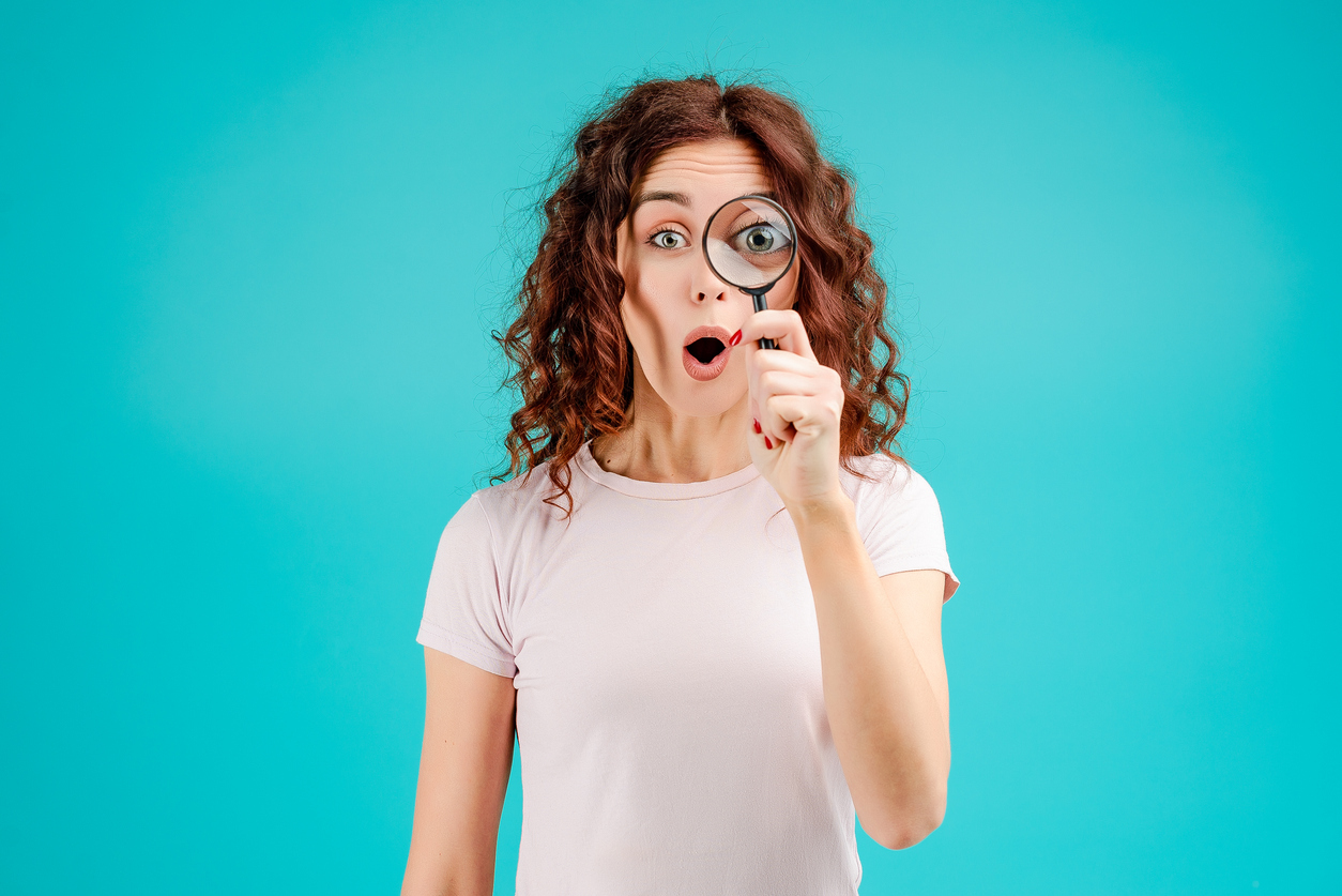 Young woman with curly hair isolated over bright colorful background