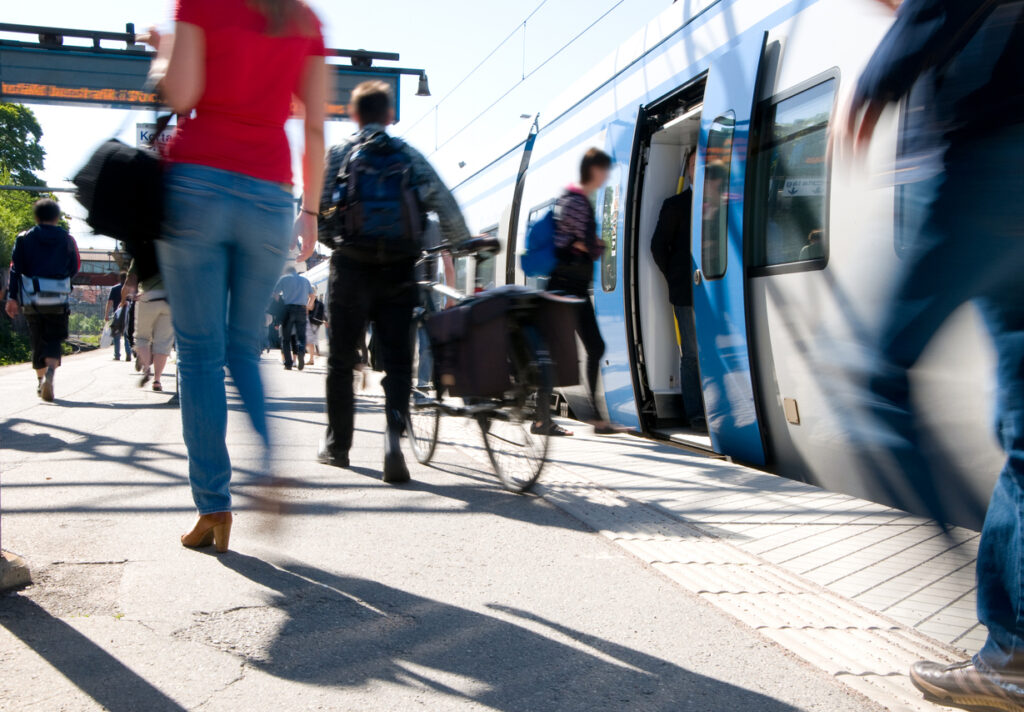 Train passengers entering commuter carriage
